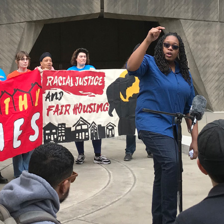 woman-in-front-of-protest-signs